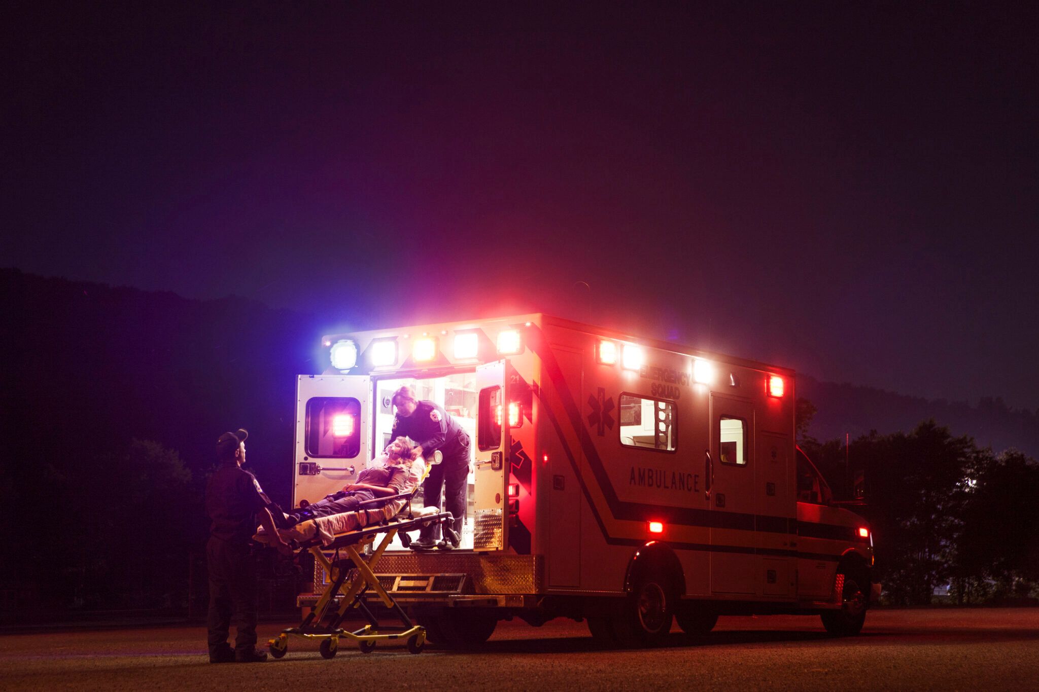 Ambulance arriving at emergency room at night