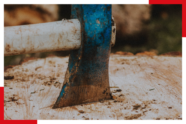 Axe cutting into wood