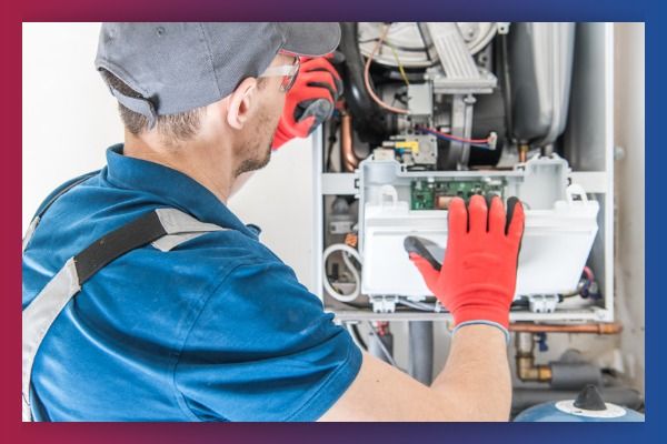 HVAC worker a furnace