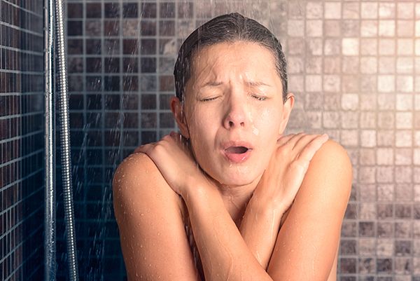 Image of a woman in a cold shower