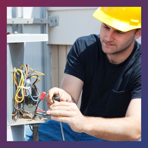 an hvac worker working on an ac unit Blog Img 1.jpg