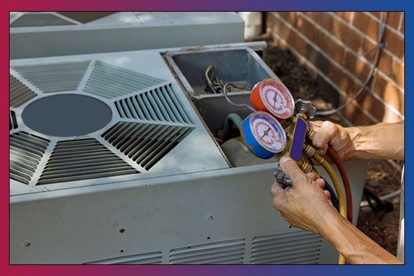 HVAC worker fixing air conditioner