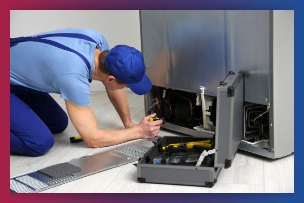 HVAC worker fixing refrigerator 