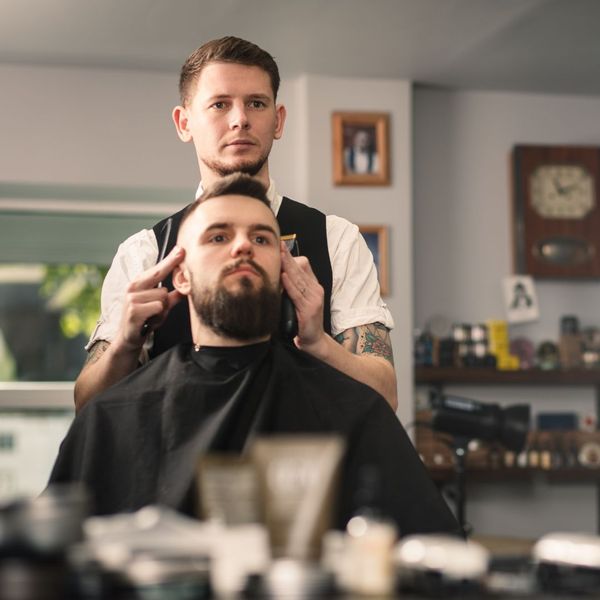 a person using a house as a barber shop