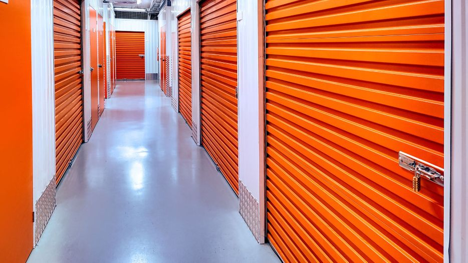 Storage units with orange doors.
