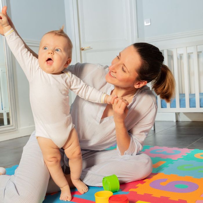 Pediatric Physical Therapist and an infant.