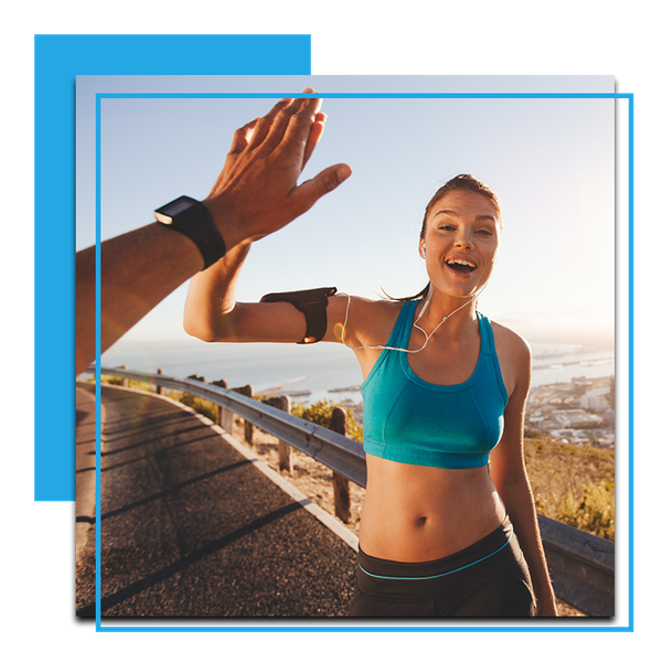 Image of a woman exercising high fiving her friend 