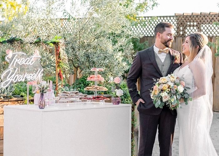 Bride and Groom in front of food table