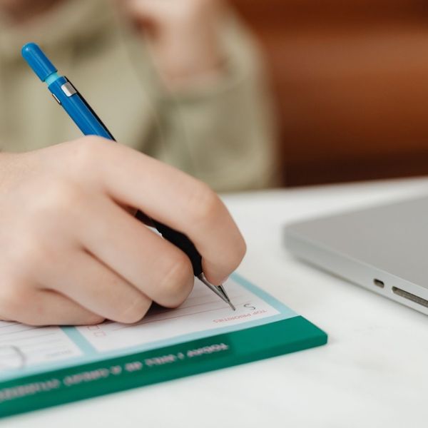 Person filling out a form