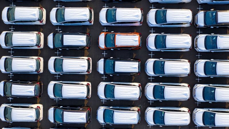 rows of fleet vehicles parked in lot rows of fleet vehicles parked in lot