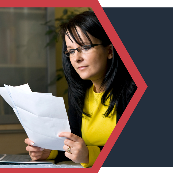 woman looking over paperwork