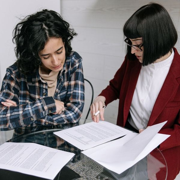 Two people looking over documents