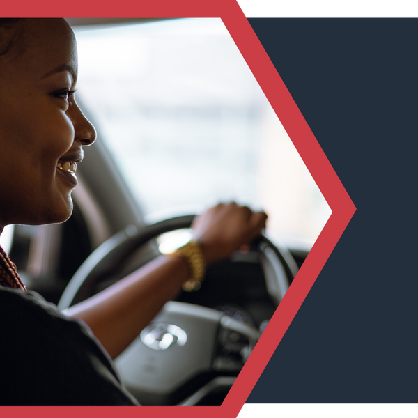 smiling woman driving car