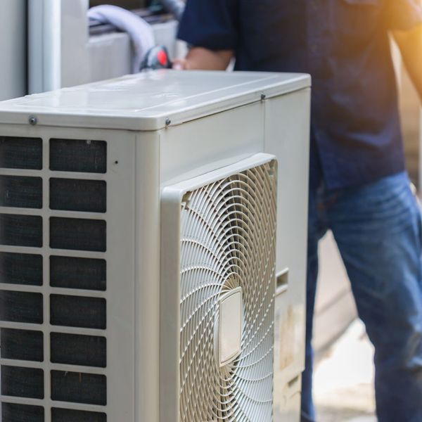 man in front of hvac unit