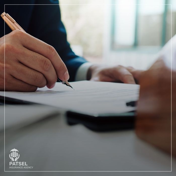 signing insurance papers