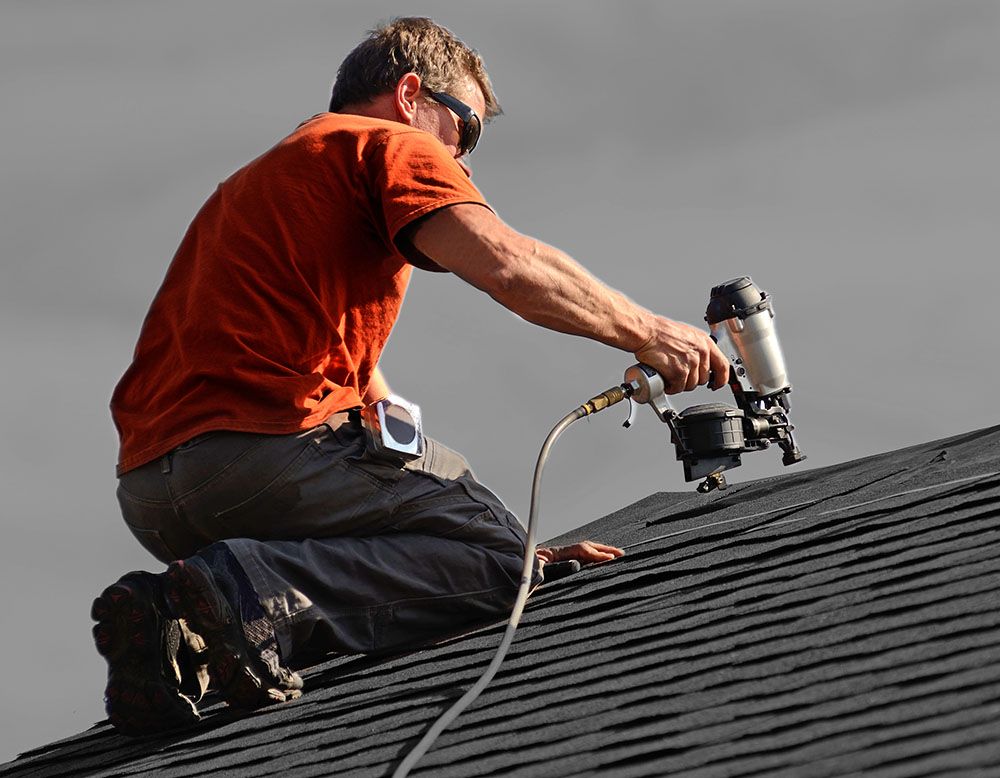 man working on a roof