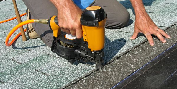 A man doing a roof repair
