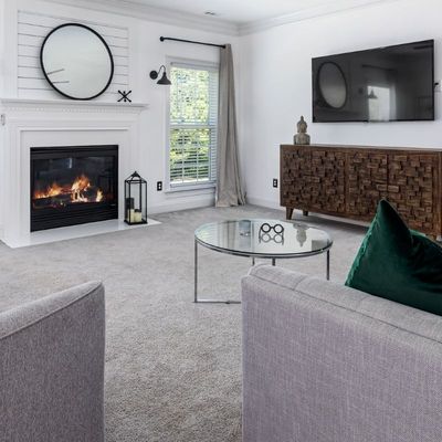 living room with freshly cleaned carpet