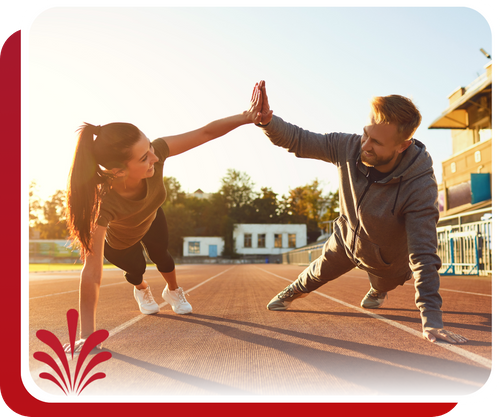 couple high fiving and exercising outdoors