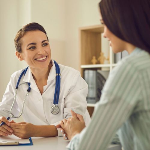 woman talking to a doctor woman talking to a doctor