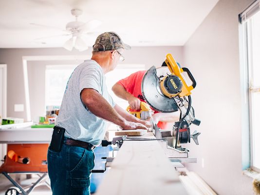 Image of a contractor using a saw