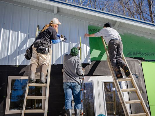 Image of contractors installing siding