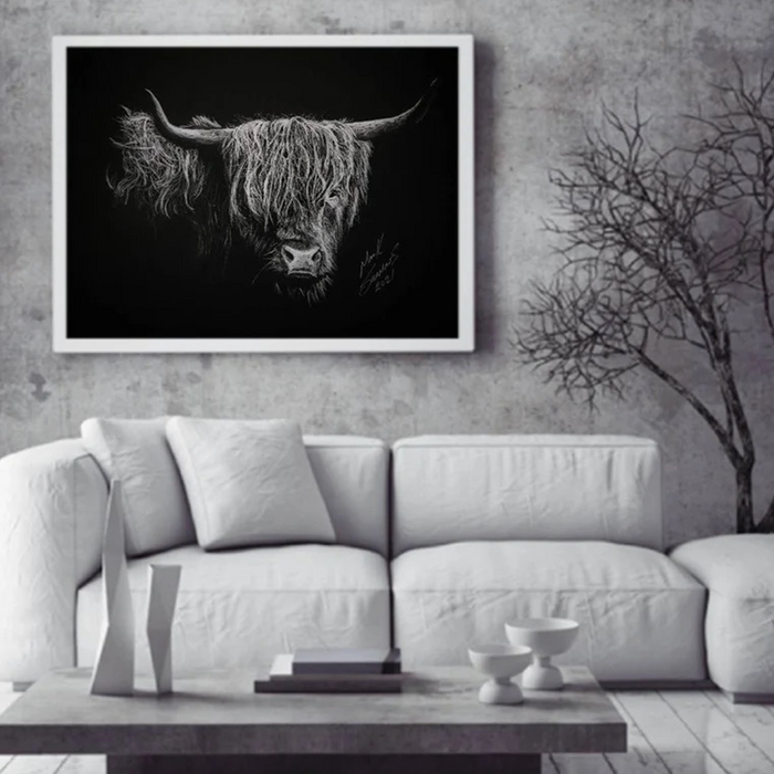 A white charcoal drawing of cows hanging in a luxury living room