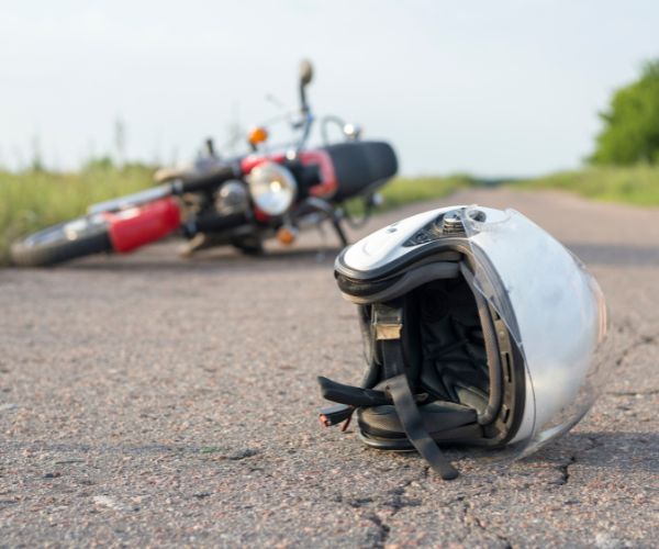 motorcycle bike and helmet on pavement 