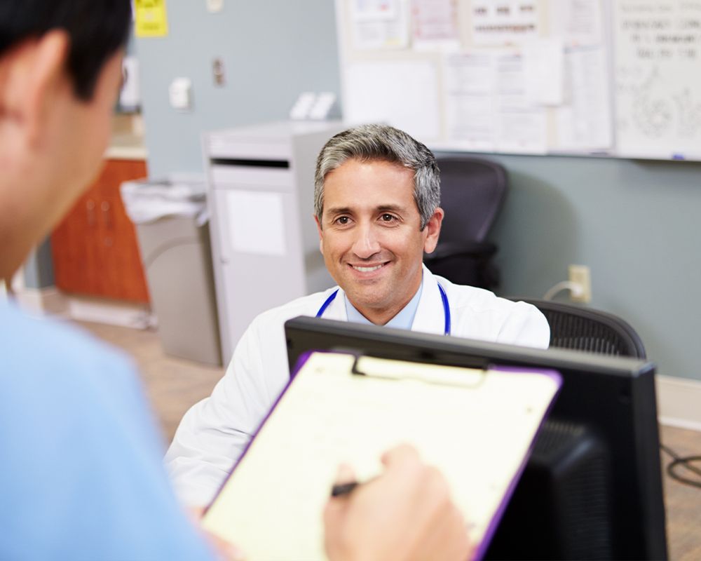 Front desk worker smiling