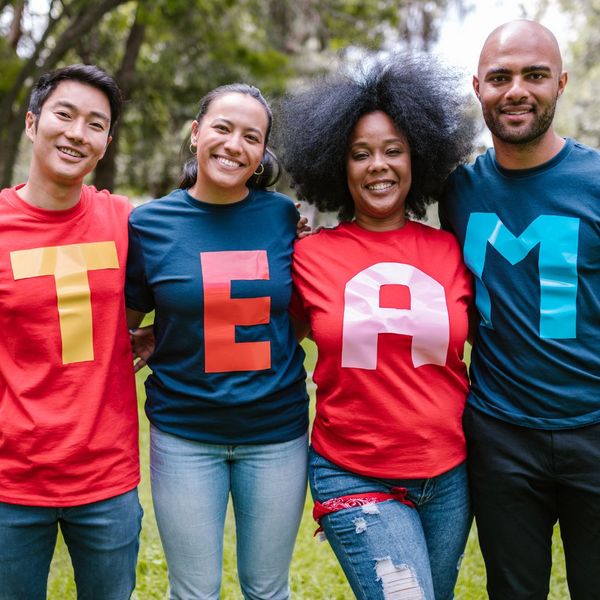 A group of people wearing TEAM shirts. A group of people wearing TEAM shirts.