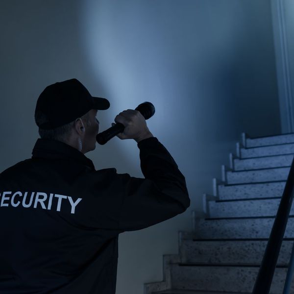 security guard with flashlight