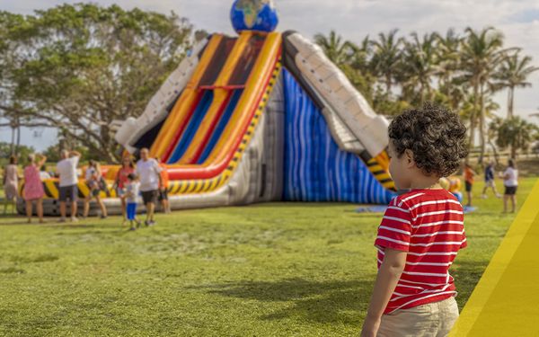 child near bounce house 