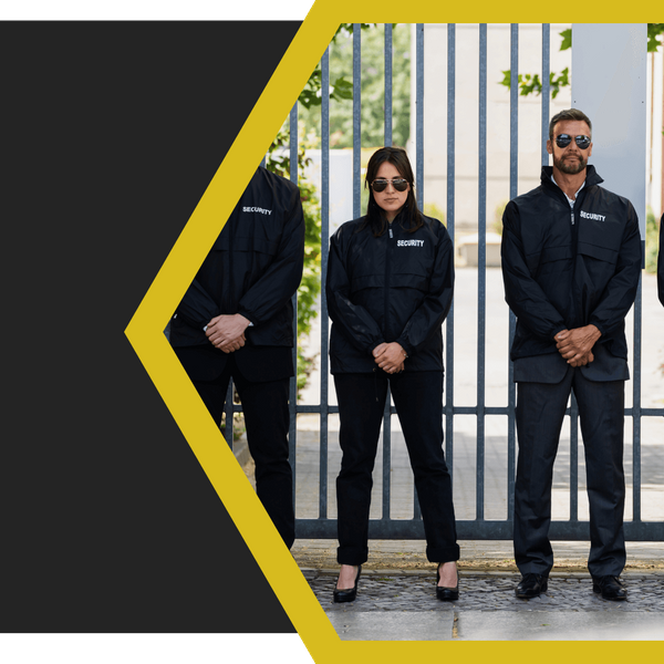 security guards standing in front of a gate