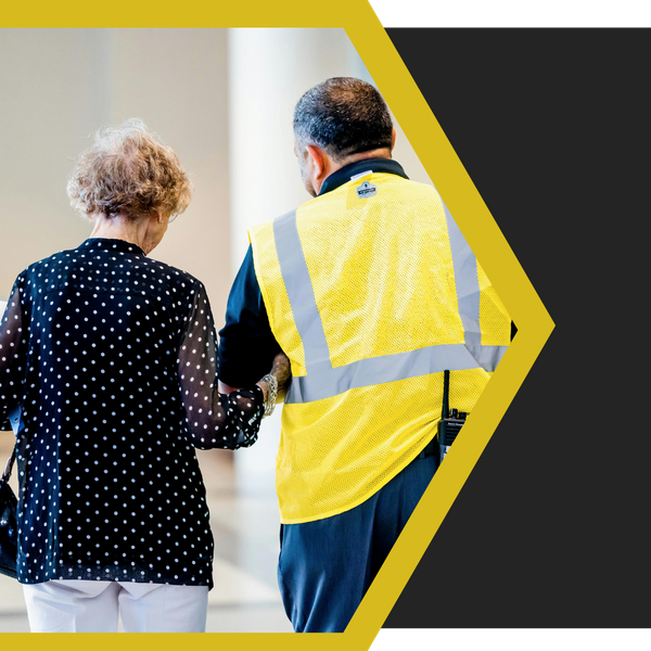 security guard walking with a woman