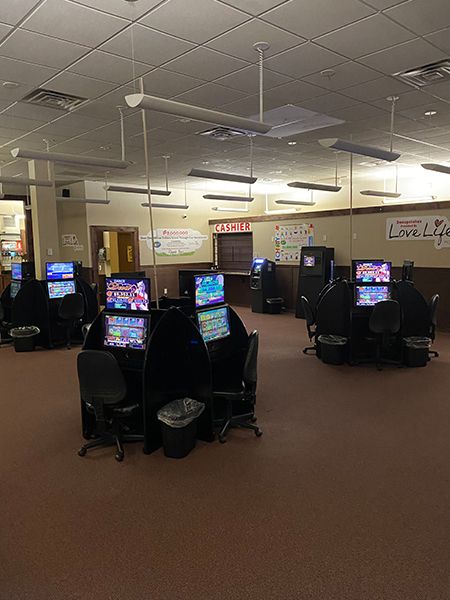 a sweepstates location game floor with many slot machines