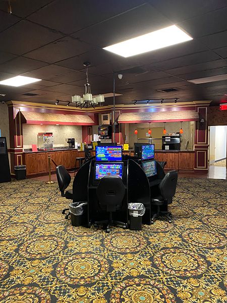 a sweepstates location game floor with many slot machines