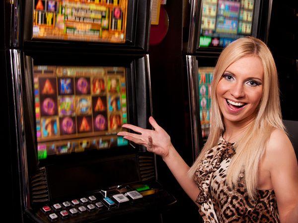 a woman having fun at a slot machine