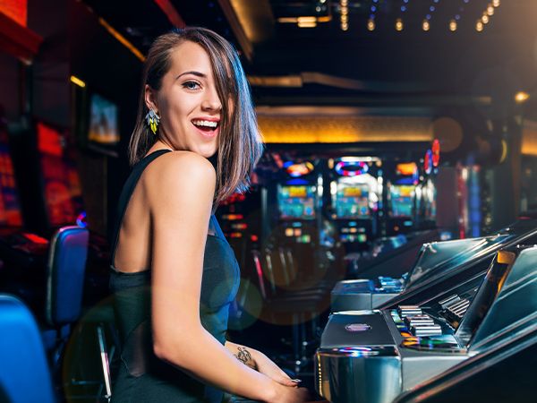 a woman having fun at a slot machine