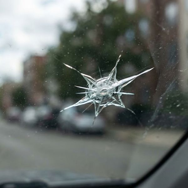 Close-up of a small star-shaped windshield chip.