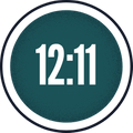 Circular icon with the time "12:11" in white text