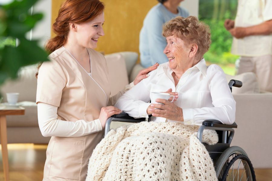 nurse with smiling resident nurse with smiling resident