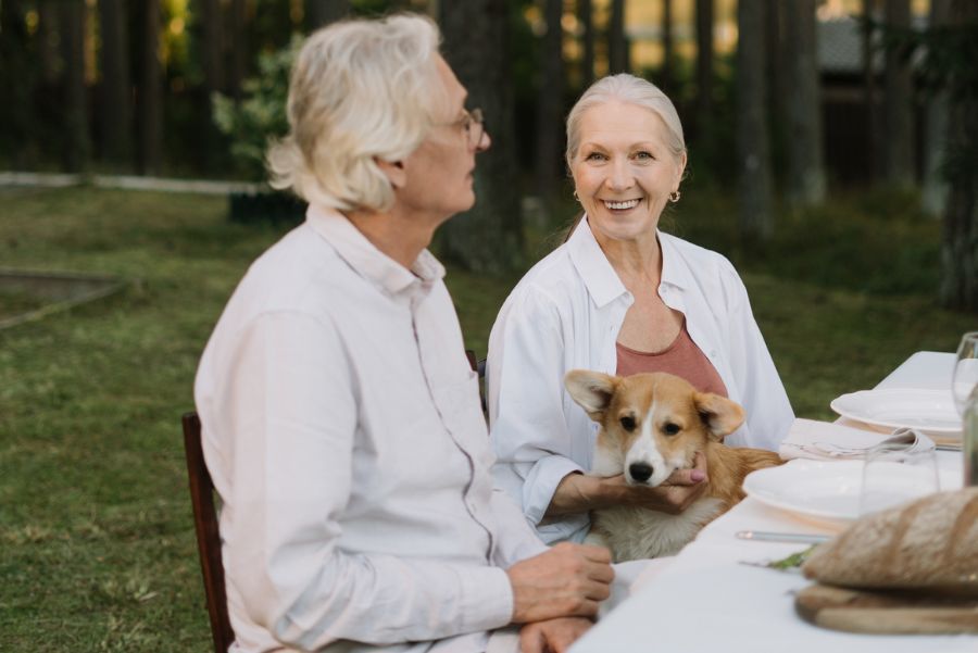 an older woman holding a dog Why Choose Us (2).jpg
