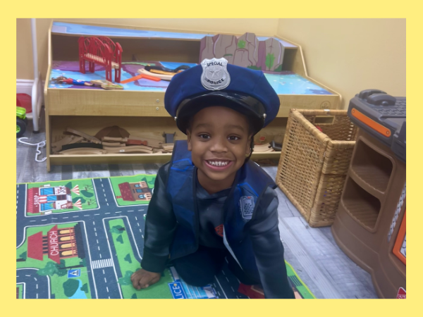 child wearing a police officer costume. 