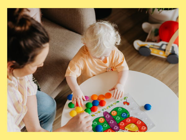 toddler playing with toys. 