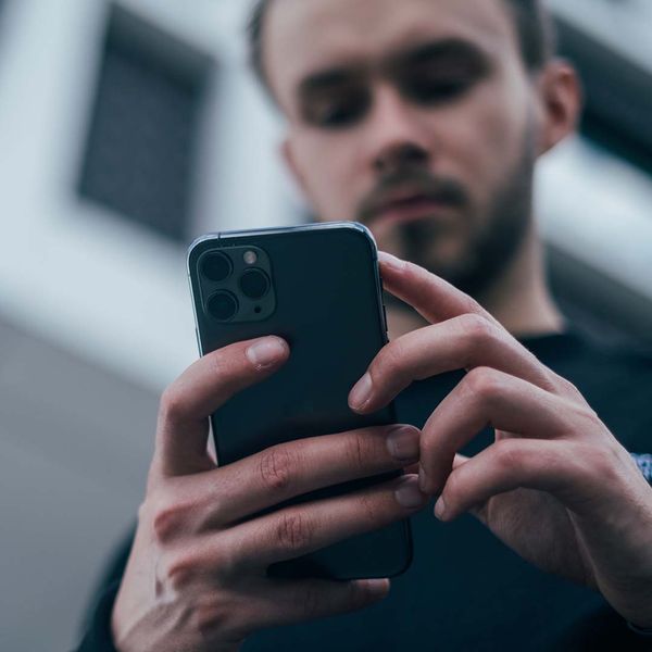 Man checking out Elite Cowboy Fitness app