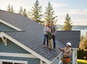 Family and Contractor on New Shingle Roof