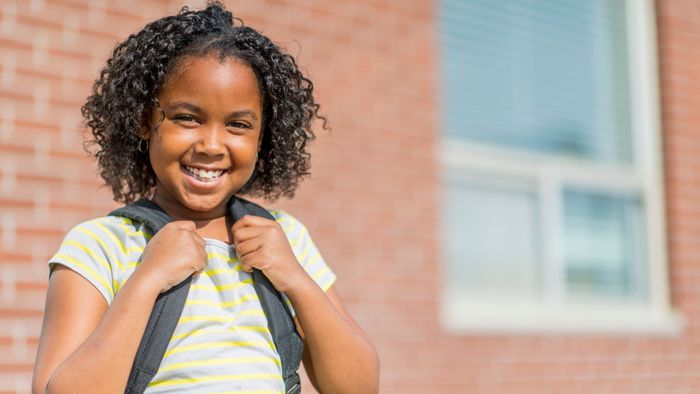 smiling girl with backpack