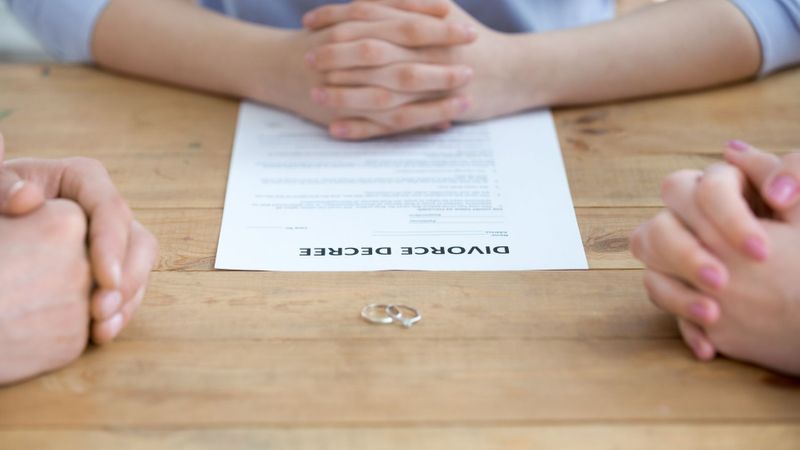 lawyer working with couple divorcing