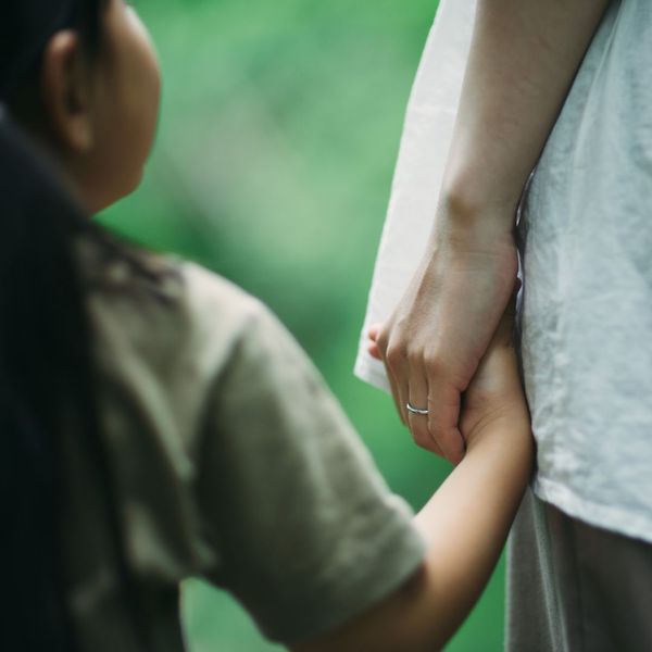 holding little girls hand