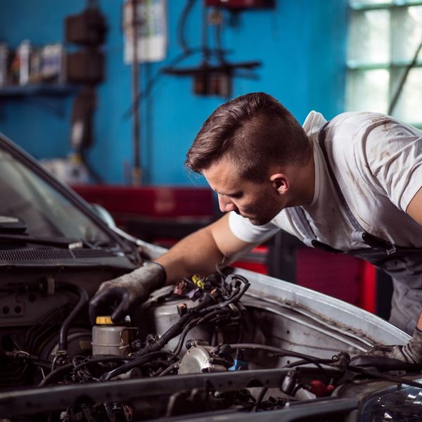 Auto technician working on car repairs